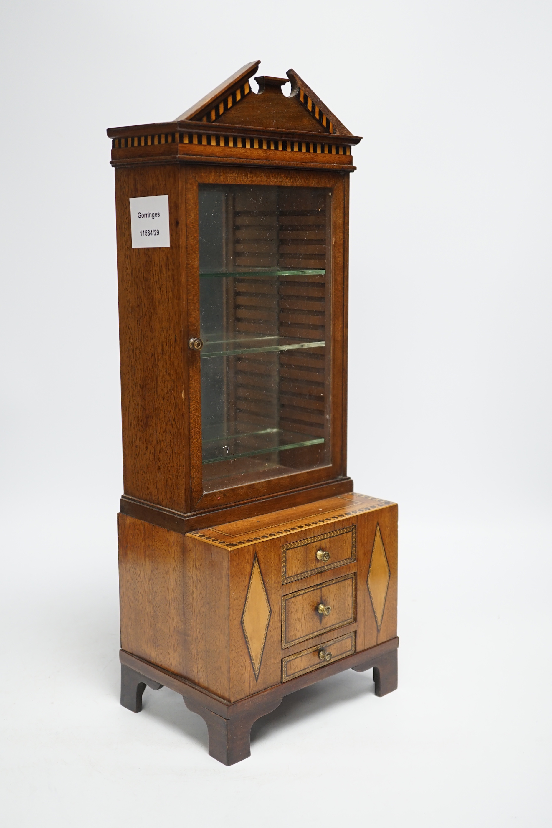 A Regency style miniature inlaid mahogany bookcase, 44cm